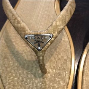 Gold Prada flip flops